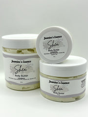 Three jars of Jasmine's Essence Shea Body Butter on a white background